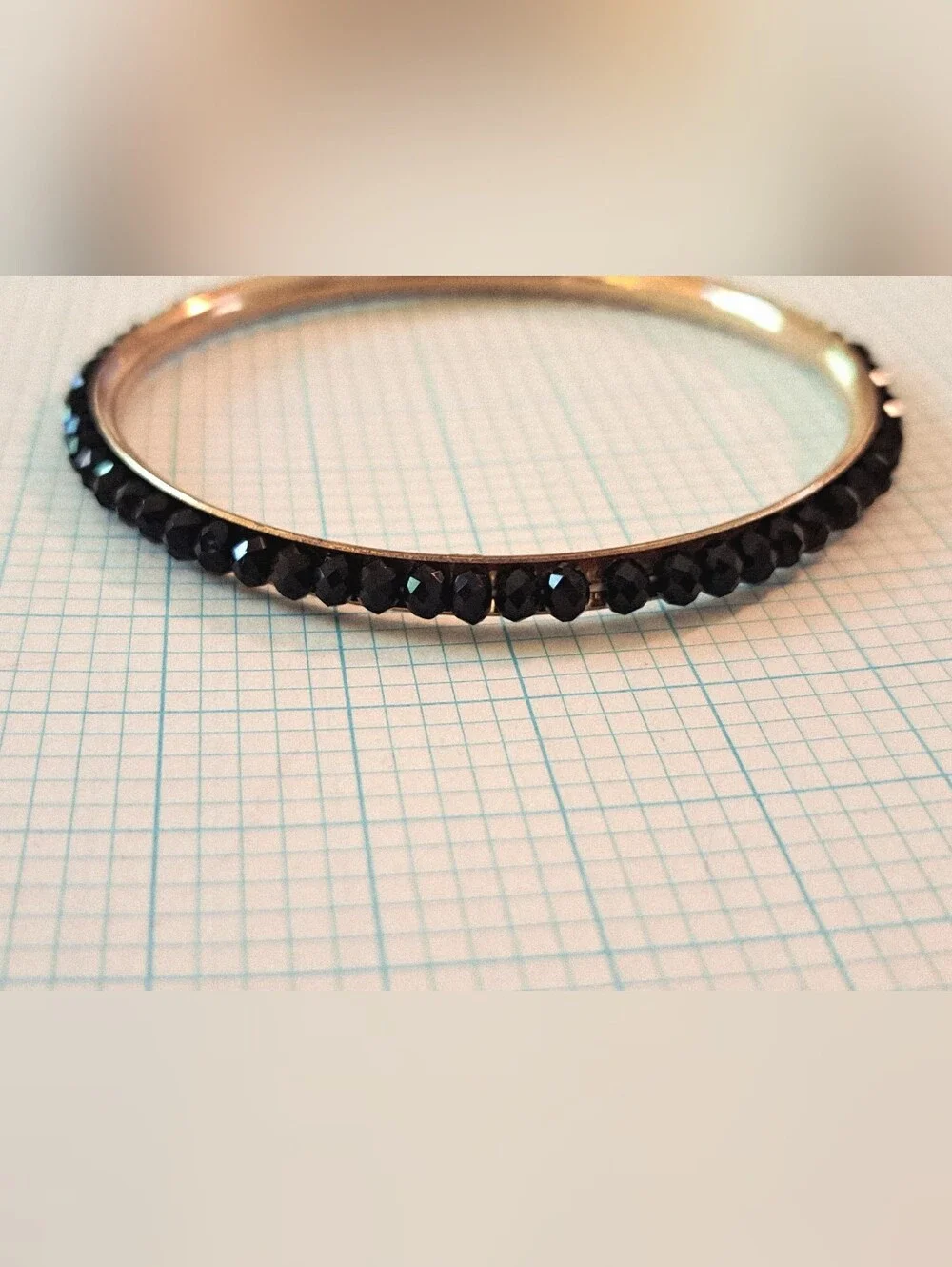 Gold-Tone Eternity Bangle Bracelet with Black Crystal Row